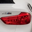 Kép 10/13 - BMW X6 M elektromos 12 Voltos kiautó gyerekeknek bőrüléssel, gumi kerékkel, távirányítóval